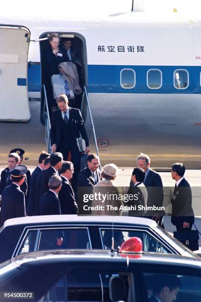 King Baudouin and Queen Fabiola of Belgium are welcomed by Crown Prince Naruhito on arrival at Haneda Airport on November 10, 1990 in Tokyo, Japan.