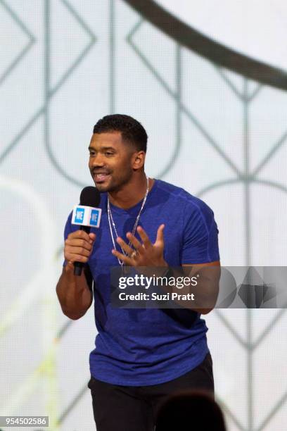 Seattle Seahawks quarterback Russell Wilson speaks at WE Day at Key Arena on May 3, 2018 in Seattle, Washington.