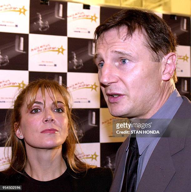 Actor Liam Neeson and wife Natasha Richardson arrive at the "Movie Action for Children" auction 06 March 2001 at Sotheby's in New York. Movie...