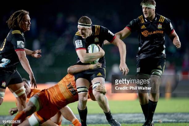 Brodie Retallick of the Chiefs is tackled during the round 12 Super Rugby match between the Chiefs and the Jaguares at Rotorua International Stadium...