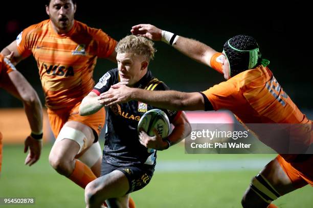 Damian McKenzie of the Chiefs makes a break during the round 12 Super Rugby match between the Chiefs and the Jaguares at Rotorua International...