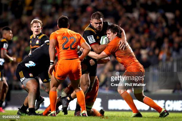 Angus Ta'avao-Matau of the Chiefs is tackled during the round 12 Super Rugby match between the Chiefs and the Jaguares at Rotorua International...