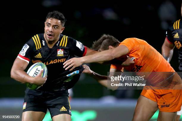 Anton Lienert-Brown of the Chiefs is tackled during the round 12 Super Rugby match between the Chiefs and the Jaguares at Rotorua International...