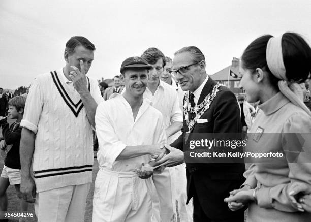 Lancashire captain Jack Bond is presented with a winner's cheque after Lancashire won the Player's County League match against Warwickshire at the...