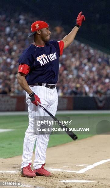 National League All-Star Ken Griffey, Jr,. Of the Cincinnati Reds points as his hit sails foul for his last out during the Home Run Derby 10 July...