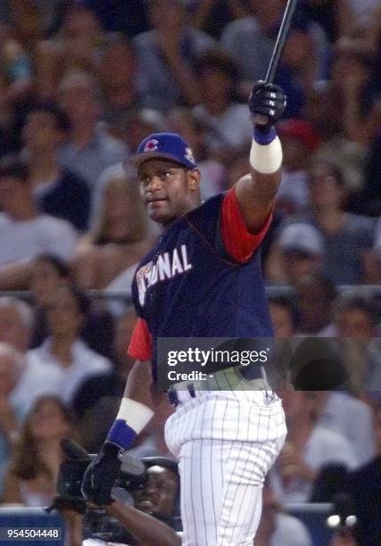 National League All-Star Sammy Sosa of the Chicago Cubs watches one one his home runs fly out of the park during the final round of the Home Run...