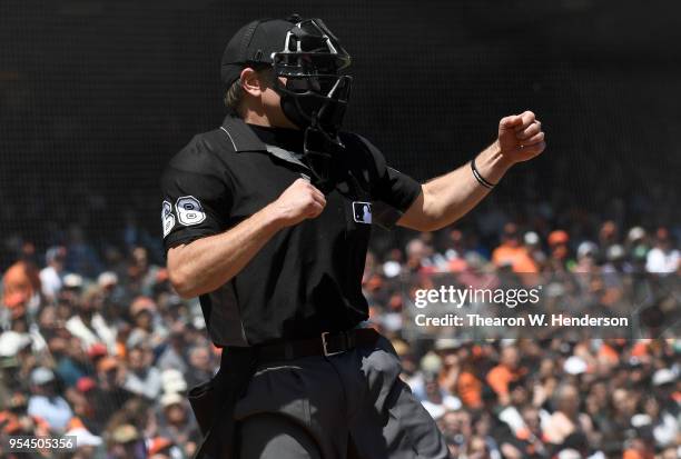 Home plate umpire Chris Guccione calls strike three on batter Kelby Tomlinson of the San Francisco Giants against the San Diego Padres in the bottom...