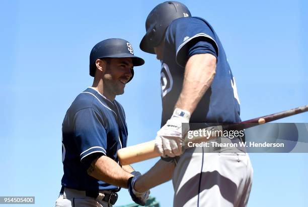 Matt Szczur of the San Diego Padres is congratulated by Chase Headley after Szczur hit a solo home run against the San Francisco Giants in the top of...