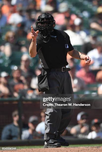 Home plate umpire Chris Guccione calls a strike on batter Matt Szczur of the San Diego Padres against the San Francisco Giants in the top of the six...