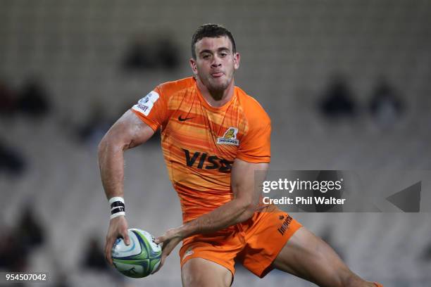 Nicolas Sanchez of the Jaguares passes during the round 12 Super Rugby match between the Chiefs and the Jaguares at Rotorua International Stadium on...