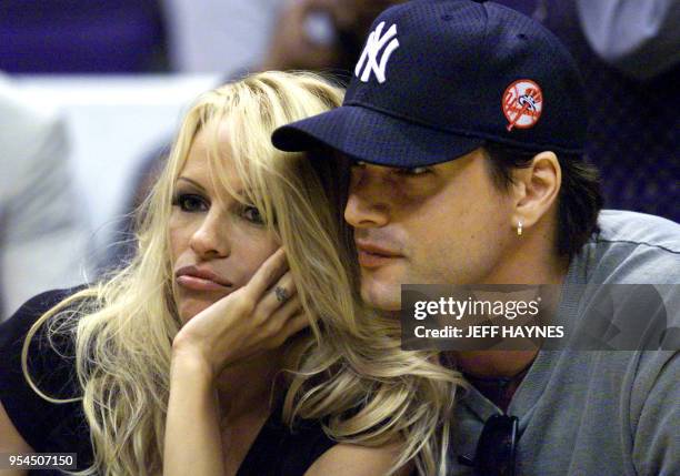 Actress Pamela Anderson Lee and current boyfriend Marcus Schenkenberg watch game two of the NBA Finals series between the Los Angeles Lakers and the...