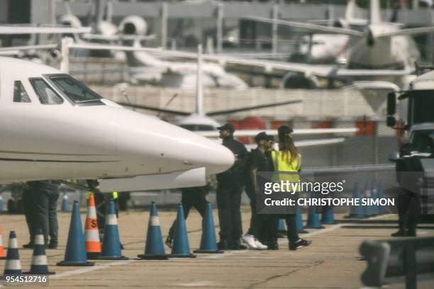 Paris Saint-Germain's Brazilian forward Neymar is pictured as he disembarks a private jet on the tarmac of Le Bourget airport near Paris on May 4,...