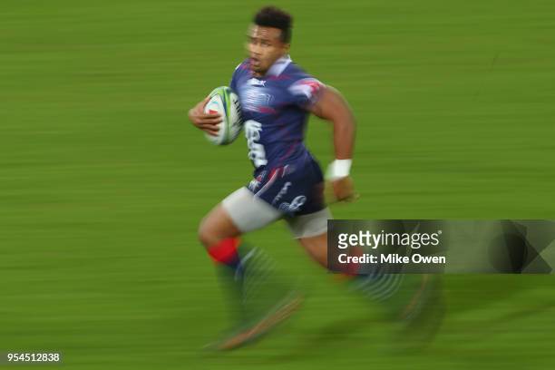 Will Genia of the Rebels runs with the ball during the round 12 Super Rugby match between the Rebels and the Crusaders at AAMI Park on May 4, 2018 in...