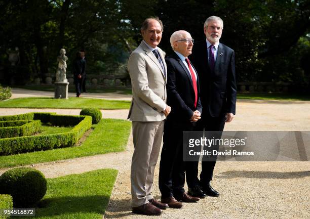 Gerry Adams, former leader of Sinn Fein, poses next to Brian Currin , member of the International Contact Group and Jean-Rene Etchegaray, Mayor of...