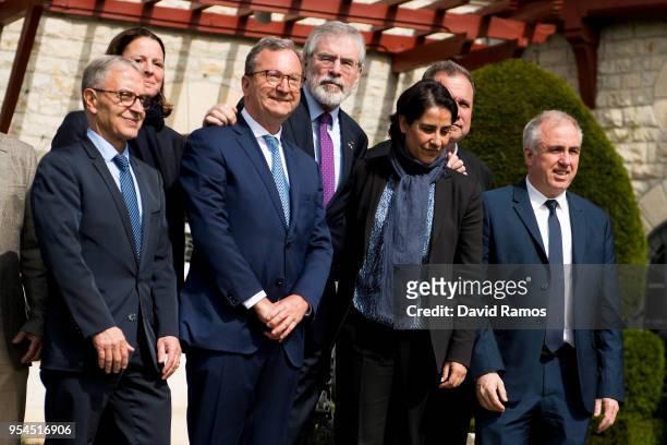 Gerry Adams , former leader of Sinn Fein, poses alongside members of the International Contact Group during an international event to advance the...