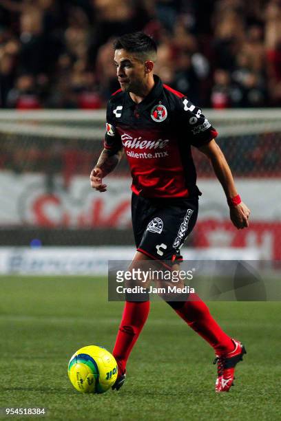 Damian Perez of Tijuana drives the ball during to the quarter finals first leg match between Tijuana and Monterrey as part of the Torneo Clausura...