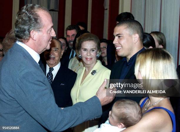 The King of Spain, Juan Carlos I , speaks to Brazilian soccer player, Ronaldo Nazario and his wife Milena Rodrigues , during a visit to the Fine Arts...