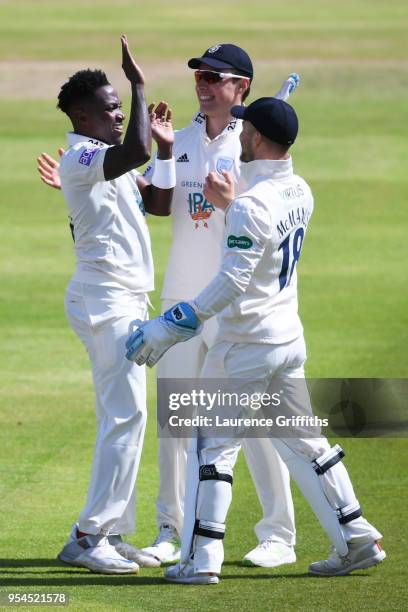 Fidel Edwards of Hampshire County Cricket Club celebrates taking the wicket of Jake Libby of Nottinghamshire County Cricket Club with Joe Weatherly...