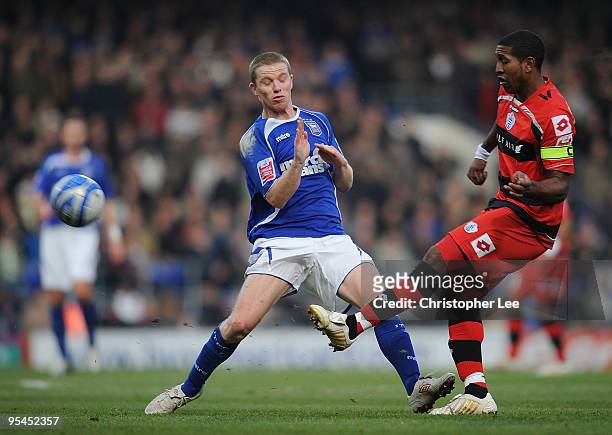 Mikele Leigertwood of QPR passes past Grant Leadbitter of Ipswich during the Coca-Cola Championship match between Ipswich Town and Queens Park...