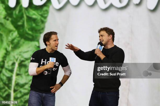 Craig Kielburger and Marc Kielburger speak at Key Arena on May 3, 2018 in Seattle, Washington.