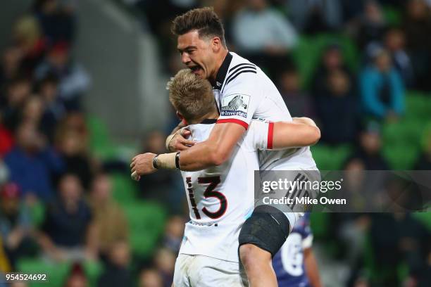 Jack Goodhue of the Crusaders celebrates a try with David Havili during the round 12 Super Rugby match between the Rebels and the Crusaders at AAMI...