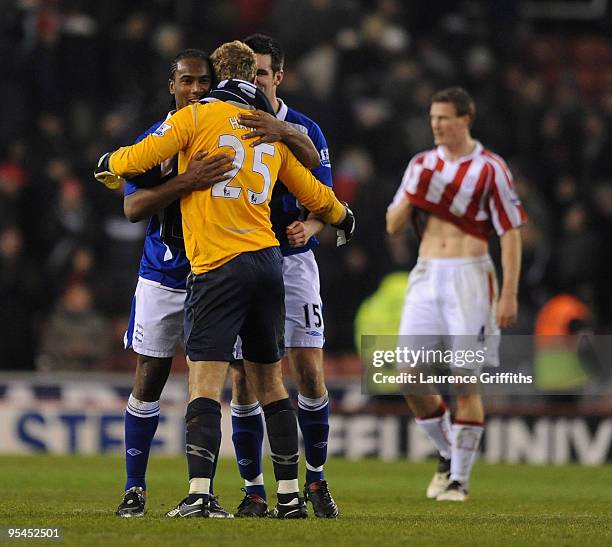 Cameron Jerome and Scott Dann of Birmingham congratulate Joe Hart on another match winning performance during the Barclays Premier League match...