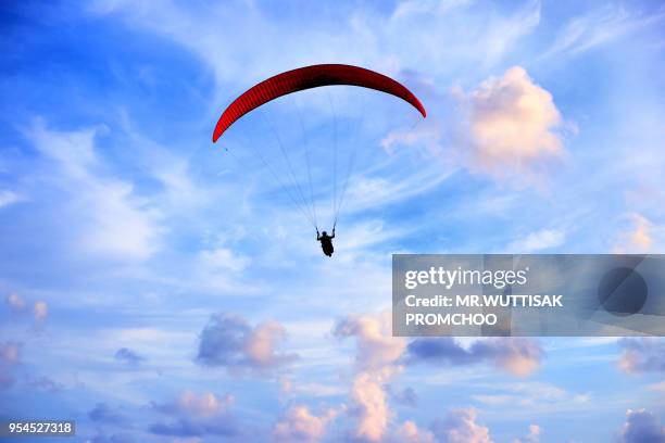 para-motor flying in the sky. - motor paraglider stock pictures, royalty-free photos & images