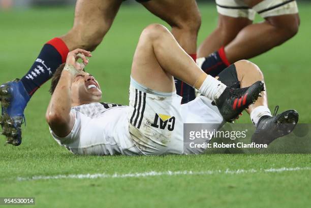 David Kaetau Havili of the Crusaders reacts after a collision with Jack Maddocks of the Rebels during the round 12 Super Rugby match between the...