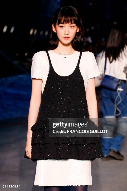 Actress Angela Yuen poses during a photocall before the Chanel Croisiere fashion show on May 3, 2018 at the Grand Palais in Paris.