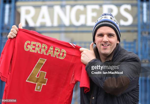 Rangers fan Derek Devine holds up a shirt as he waits for the unveiling of Steven Gerrard as the new manager of Rangers football Club at Ibrox...