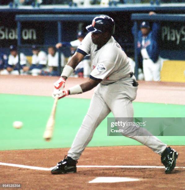 Tony Gwynn of the San Diego Padres swings during his first at bat as he gets his 3,000th career hit, a single, against Montreal Expos pitcher Dan...