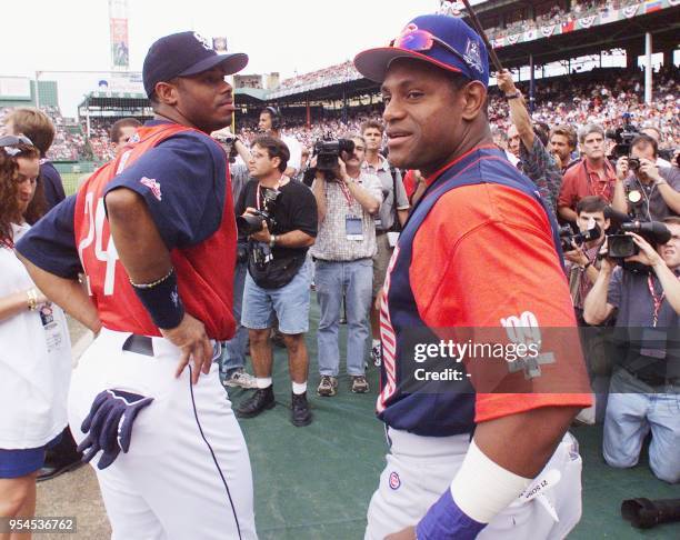 Chicago Cub Sammy Sosa of the National League and Ken Griffey Jr. Of the Seattle Mariners of the American League talk to reporters during batting...