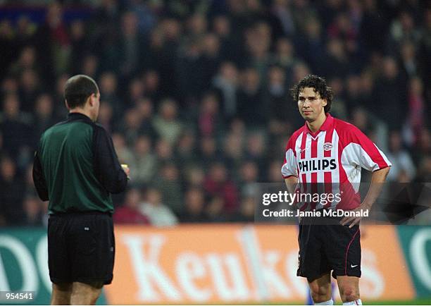 Mark Van Bommel of PSV Eindhoven prepares for the worst with referee Antonio Nieto during the UEFA Cup Quarter Finals second leg match against...