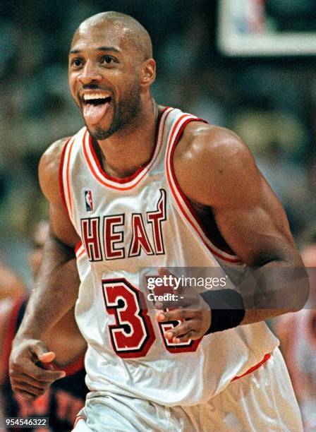 Miami Heat center Alonzo Mourning, reacts after his two-point shot give the Miami Heat a 20 point lead over the New York Knicks during third period...