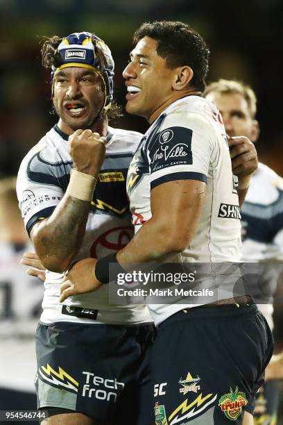 Johnathan Thurston and Jason Taumalolo of the Cowboys celebrate winning the round nine NRL match between the Penrith Panthers and the North...