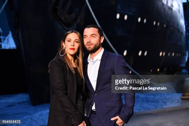 Alysson Paradis and Guillaume Gouix attend the Chanel Cruise 2018/2019 Collection at Le Grand Palais on May 3, 2018 in Paris, France.