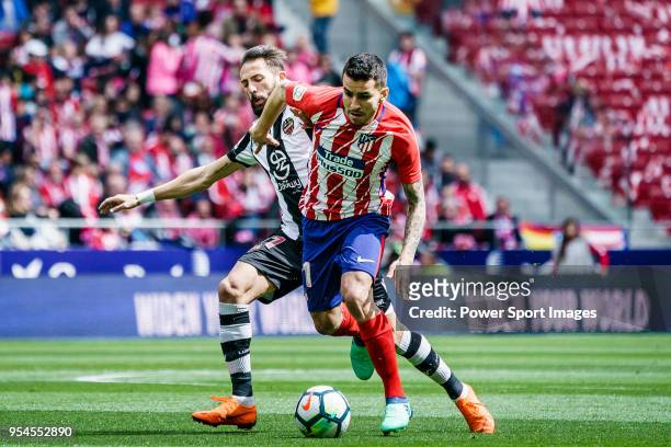 Angel Correa of Atletico de Madrid fights for the ball with Jose Luis Morales Nogales of Levante UD during the La Liga 2017-18 match between Atletico...