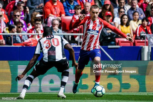 Antoine Griezmann of Atletico de Madrid fights for the ball with Aly Abeid of Levante UD during the La Liga 2017-18 match between Atletico de Madrid...