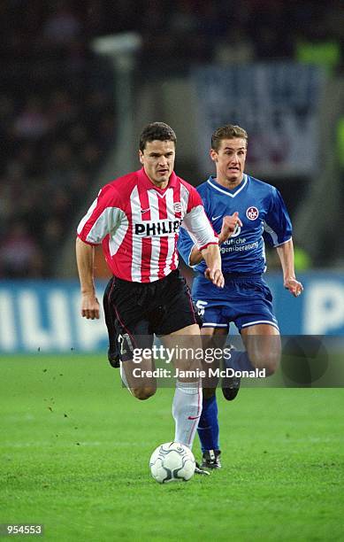 Yuri Nikiforov of PSV Eindhoven beats Miroslav Klose of Kaiserslautern during the UEFA Cup Quarter Finals second leg match played at the Philips...