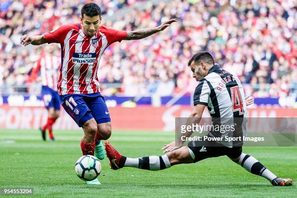 Angel Correa of Atletico de Madrid fights for the ball with Roberto Suarez Pier, Rober, of Levante UD during the La Liga 2017-18 match between...