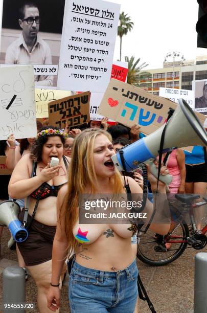 Participants of the annual "SlutWalk" march through the Israeli Mediterranean coastal city of Tel Aviv on May 4, 2018 to protest against rape...