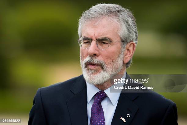 Gerry Adams, former leader of Sinn Fein, hugs Brian Currin, looks on during the International event to advance in the resolution of the conflict in...