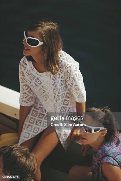 Princess Margaret, Countess of Snowdon wearing futuristic style sunglasses, on the Aga Khan's yacht, Costa Smeralda, Sardinia, Italy, August 1967.