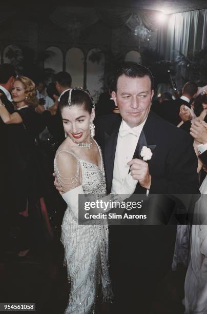 Two guests attending New Year's Eve party at Romanoff, Beverly Hills, California, US, 31st December 1956.