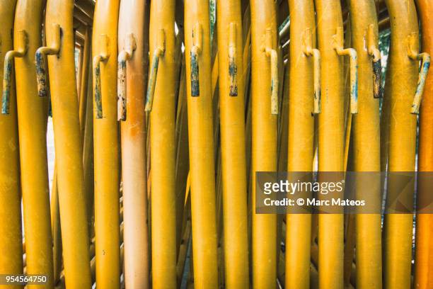 piled yellow fences - marc mateos stock pictures, royalty-free photos & images