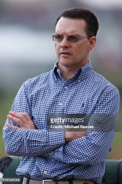 Aidan O'Brien, trainer of Mendelssohn, looks on during morning workouts in preparation for the Kentucky Derby at Churchill Downs on May 4, 2018 in...