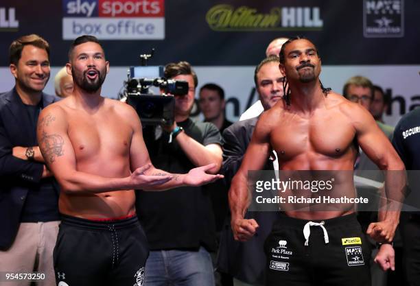 Tony Bellew and David Haye weigh in as Eddie Hearn looks on during the Weigh in ahead of the Heavyweight fight between Tony Bellew and David Haye at...