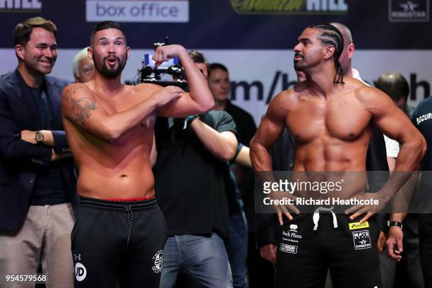 Tony Bellew and David Haye weigh in as Eddie Hearn looks on during the Weigh in ahead of the Heavyweight fight between Tony Bellew and David Haye at...