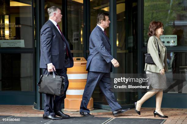 Paul Manafort, former campaign manager for Donald Trump, center, wife Kathleen Manafort, and lawyer Kevin Downing, left, arrive for a motion hearing...