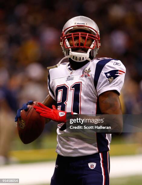 Randy Moss of the New England Patriots is seen on the field during pregame warm ups prior to the start of the game against the New Orleans Saints at...